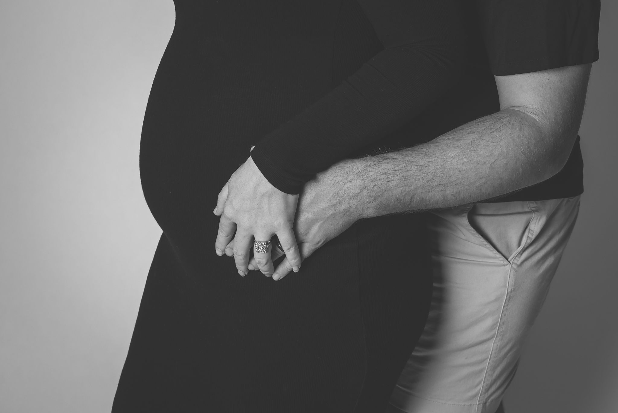 artistic black and white maternity photo highlighting baby bump
