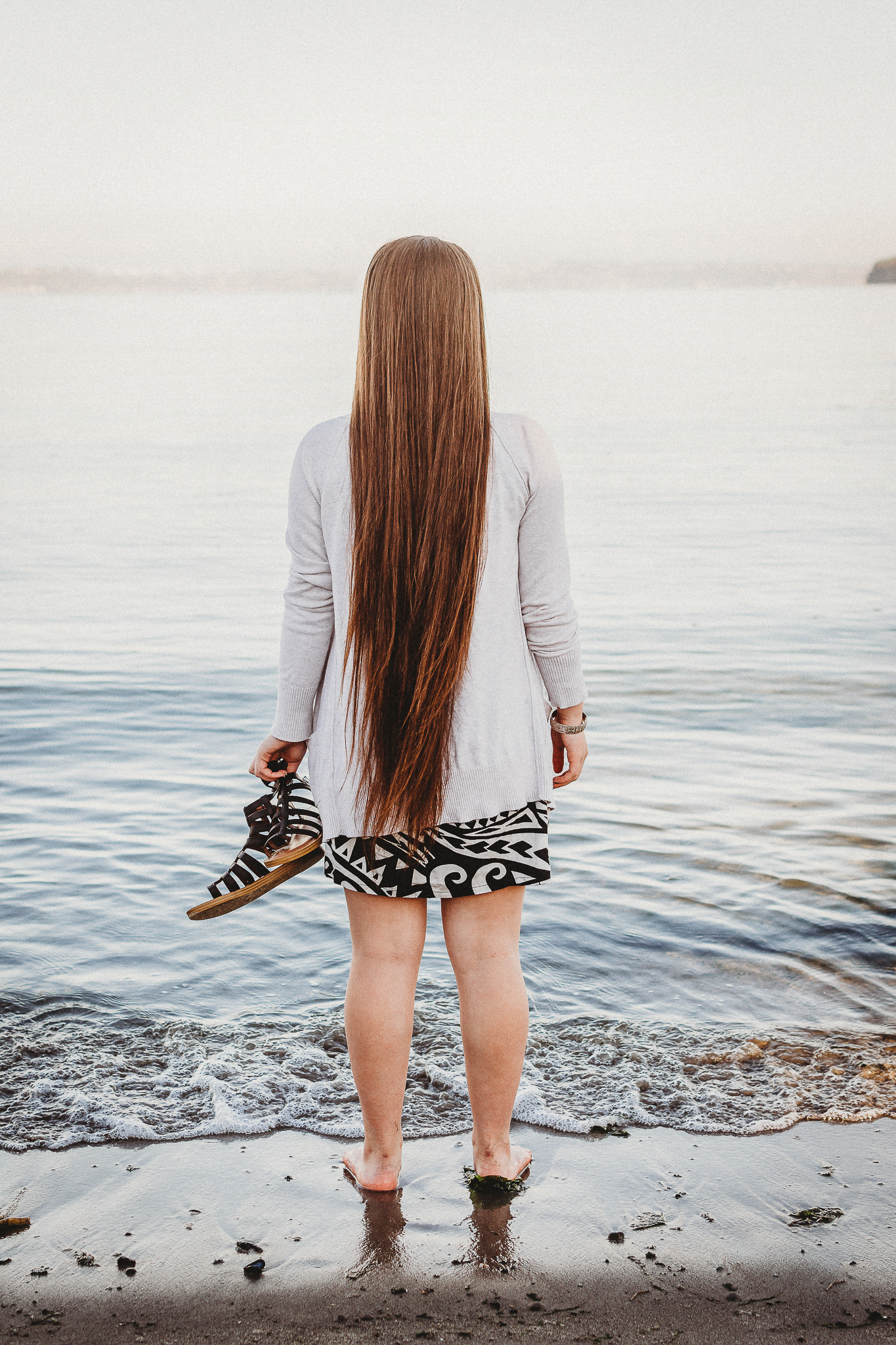 Cinematic senior beach portraits with dreamy Florida sunset colors